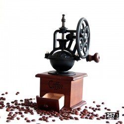 Vintage wood and cast iron coffee grinder with manual wheel mechanism