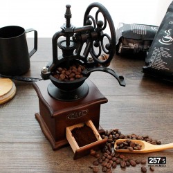 Vintage wood and cast iron coffee grinder with manual wheel mechanism